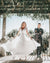 
          
            Girl in a wedding dress in front of the groom mid twirl
          
        