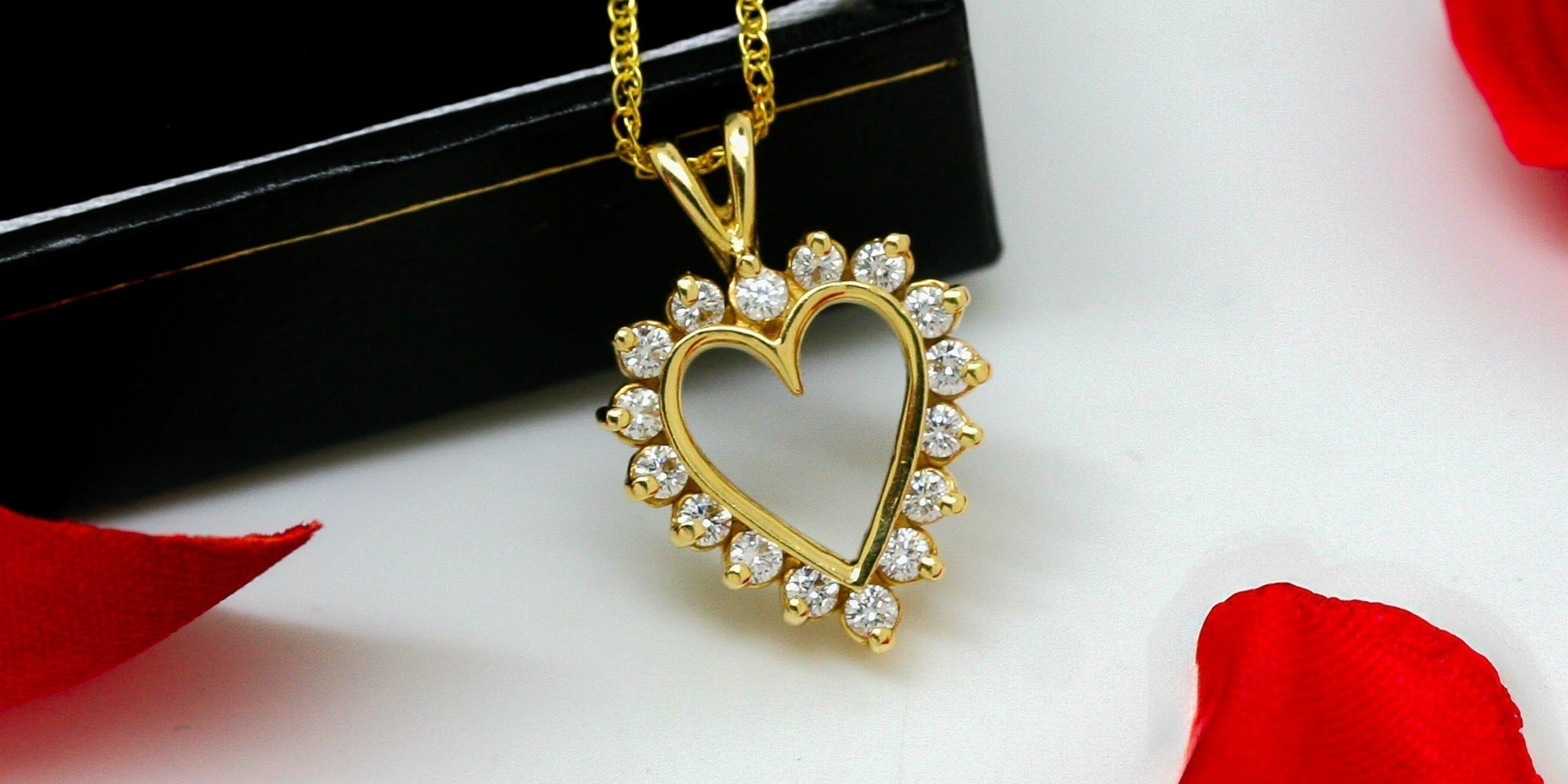 
          
            Diamond heart pendant leaning on box
          
        