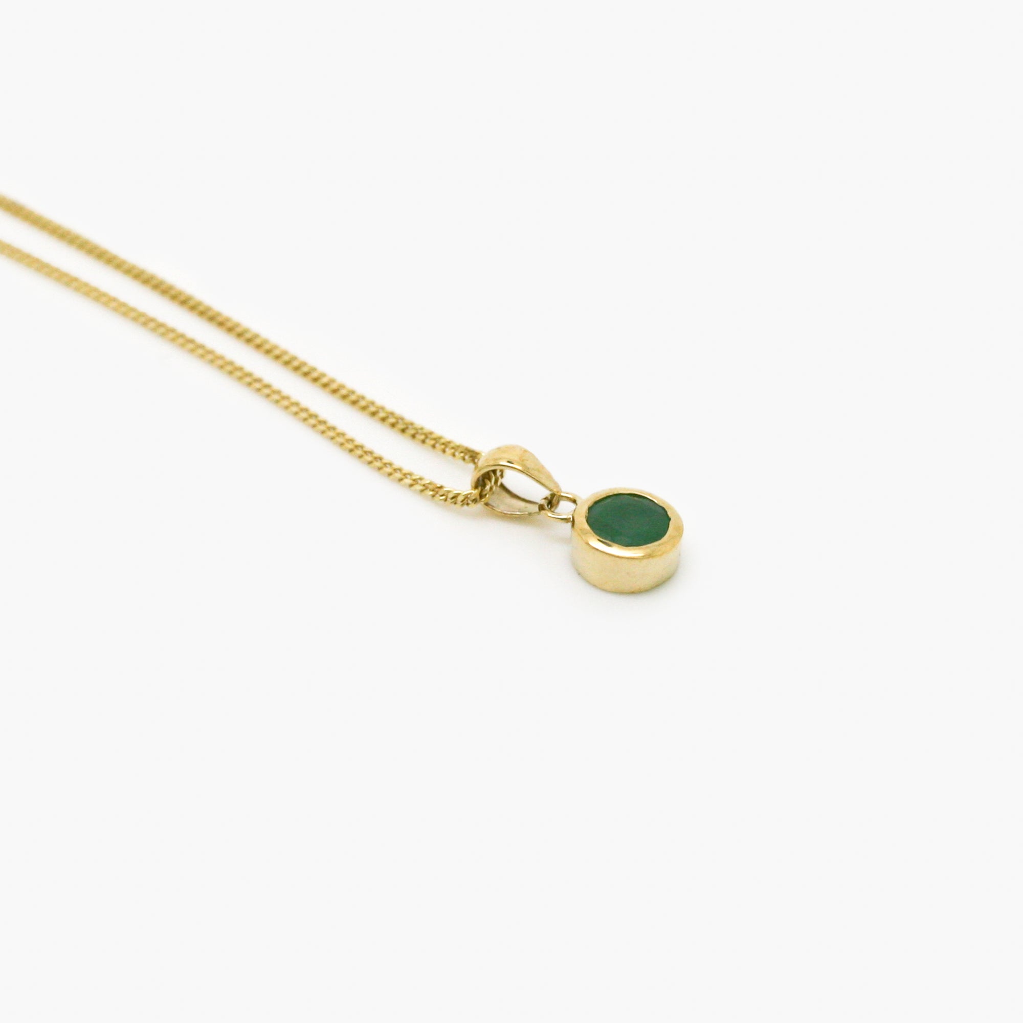 round emerald pendant