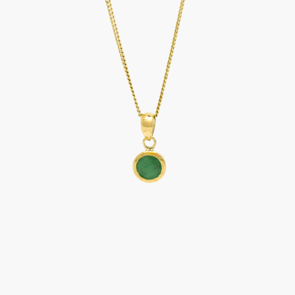 round emerald pendant