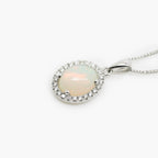 18 Carat White Gold Opal & 0.08 Carat Diamond Halo Pendant Necklace - Jordans Jewellers