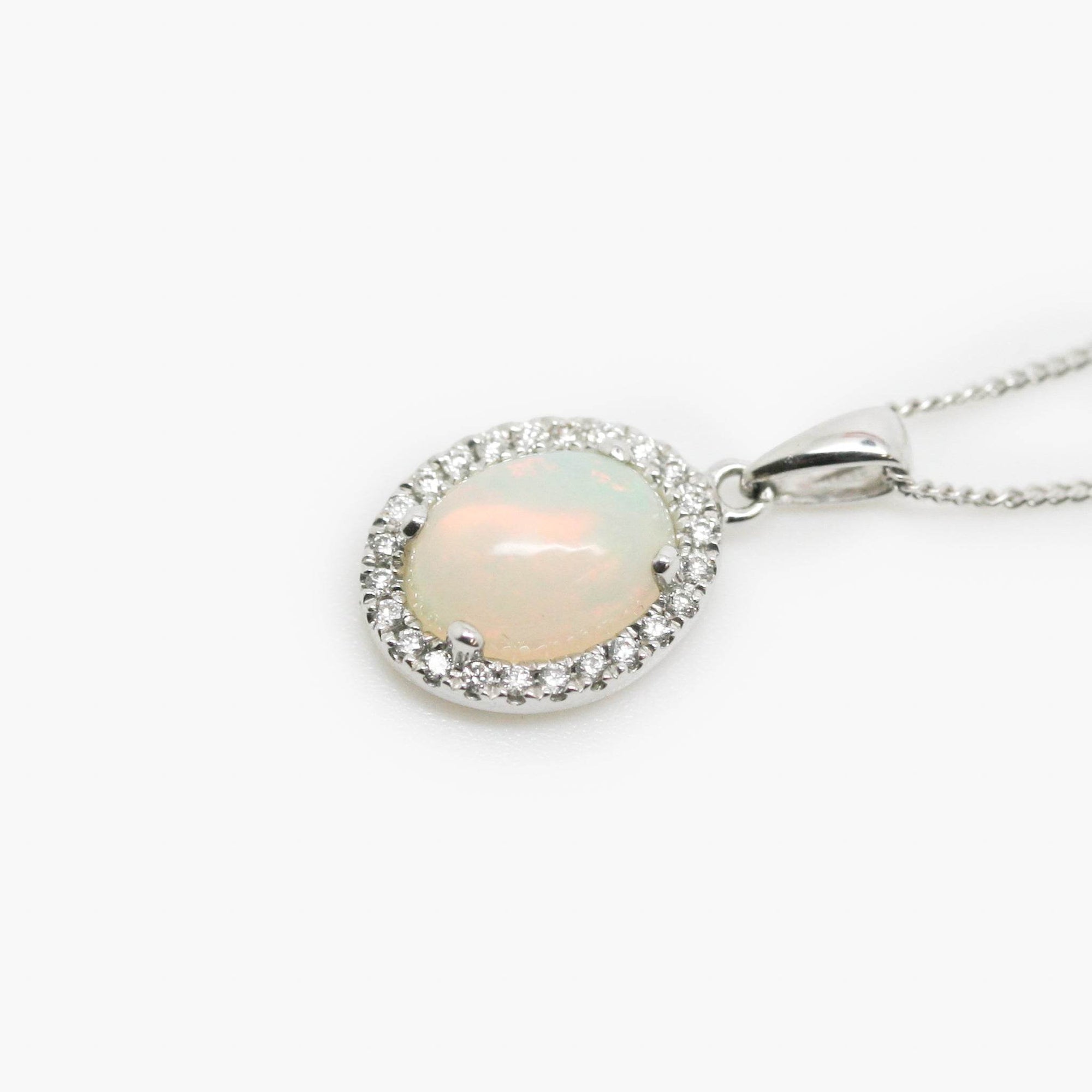 18 Carat White Gold Opal & 0.08 Carat Diamond Halo Pendant Necklace - Jordans Jewellers