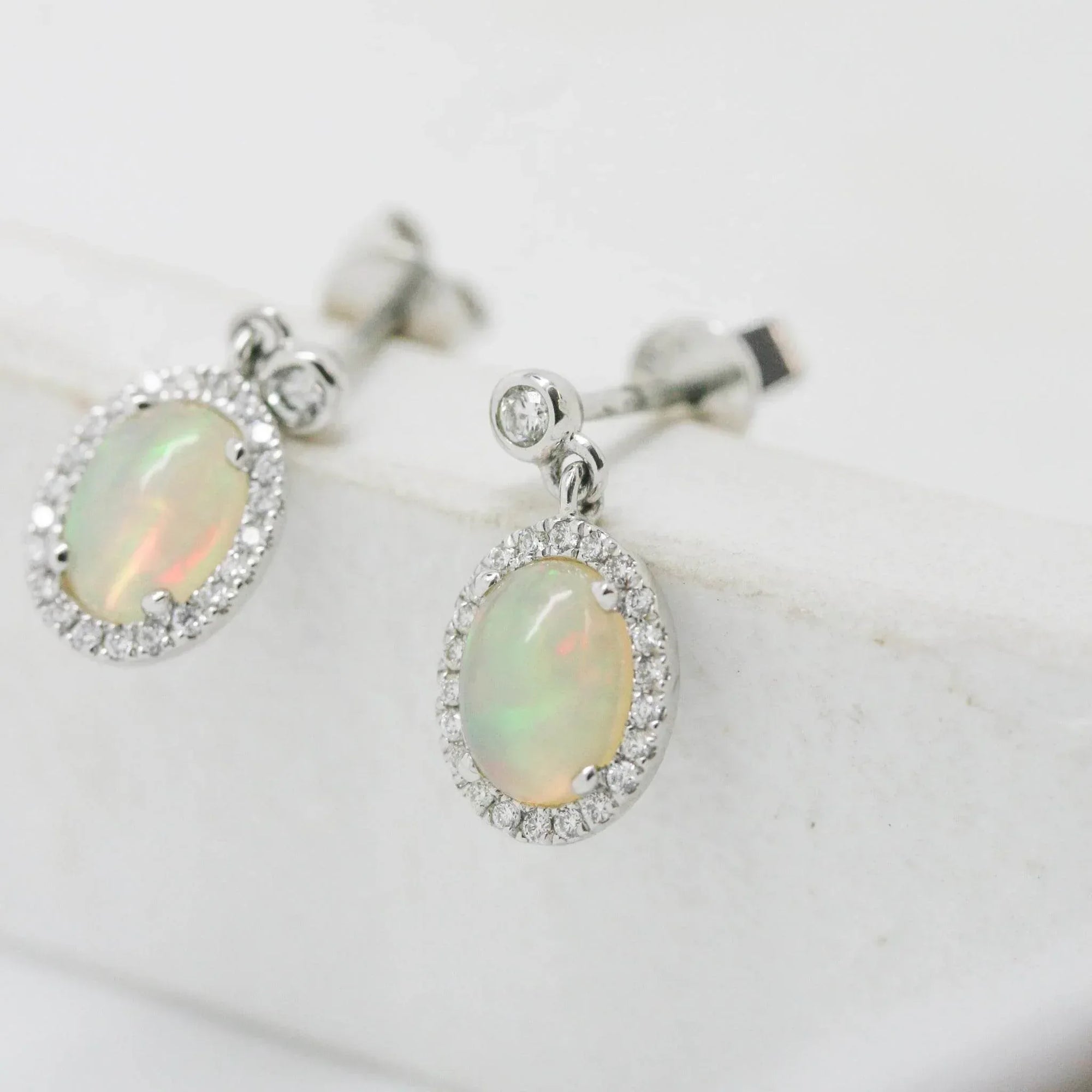 18 Carat White Gold Opal & 0.19 Carat Diamond Halo Drop Earrings - Jordans Jewellers