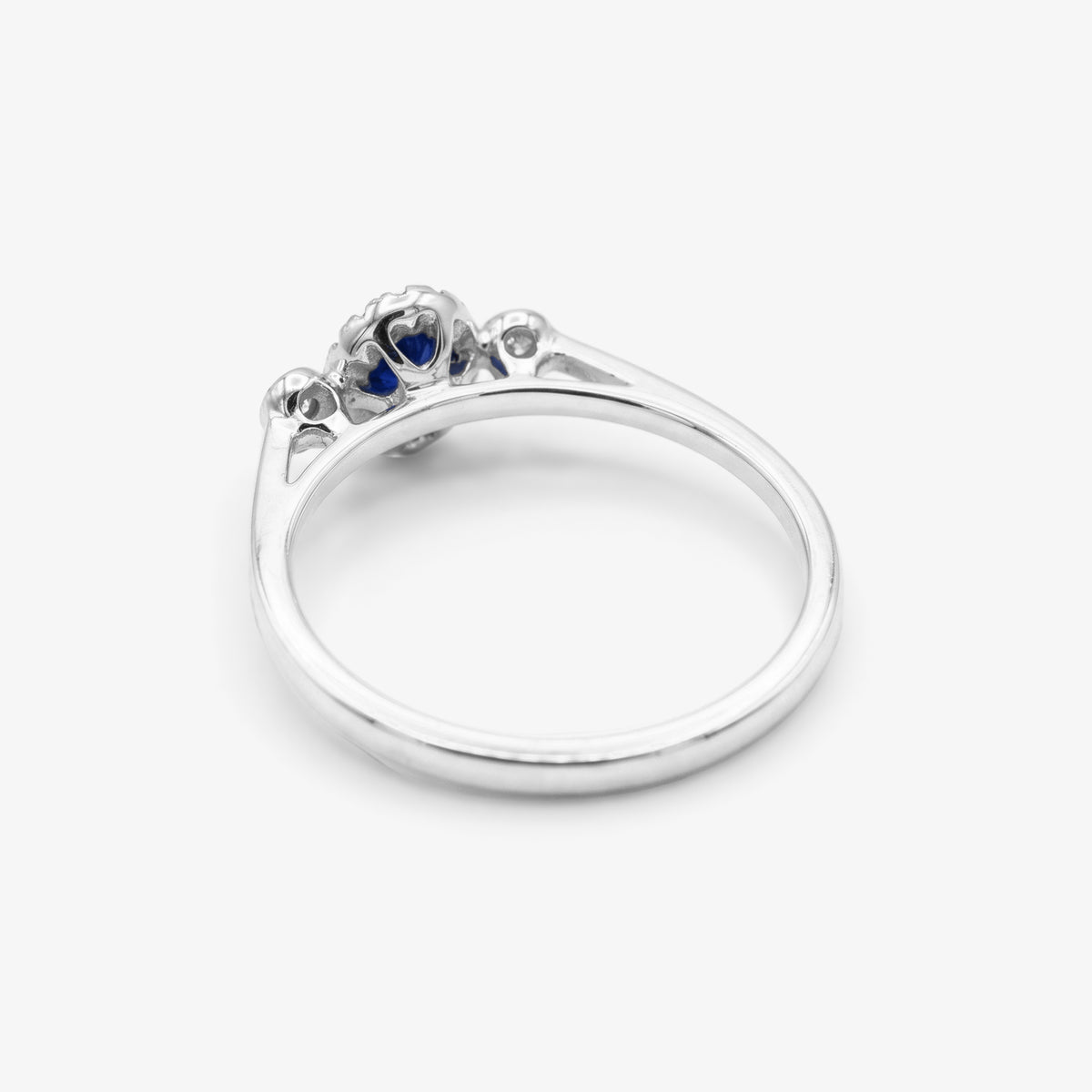 9ct White Gold Sapphire & Diamond 0.10ct Halo Ring close up
