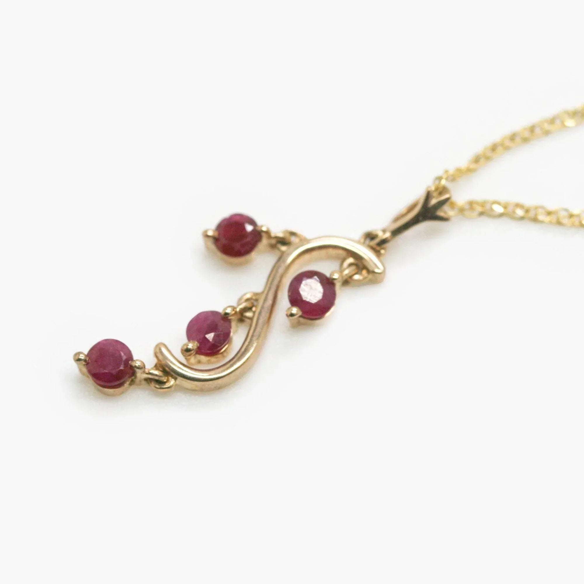 9 Carat Gold Four Stone Ruby Drop Pendant Necklace - Jordans Jewellers