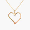Close up shot of a yellow gold heart pendant
