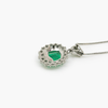 Back photo of platinum emerald and diamond pendant necklace