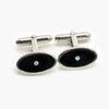Black enamel cufflinks with a diamond in the centre