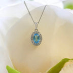 NEW 9ct White Gold Oval Blue Topaz and Diamond Cluster Pendant Necklace - Jordans Jewellers
