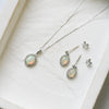 18 Carat White Gold Opal & 0.08 Carat Diamond Halo Pendant Necklace
