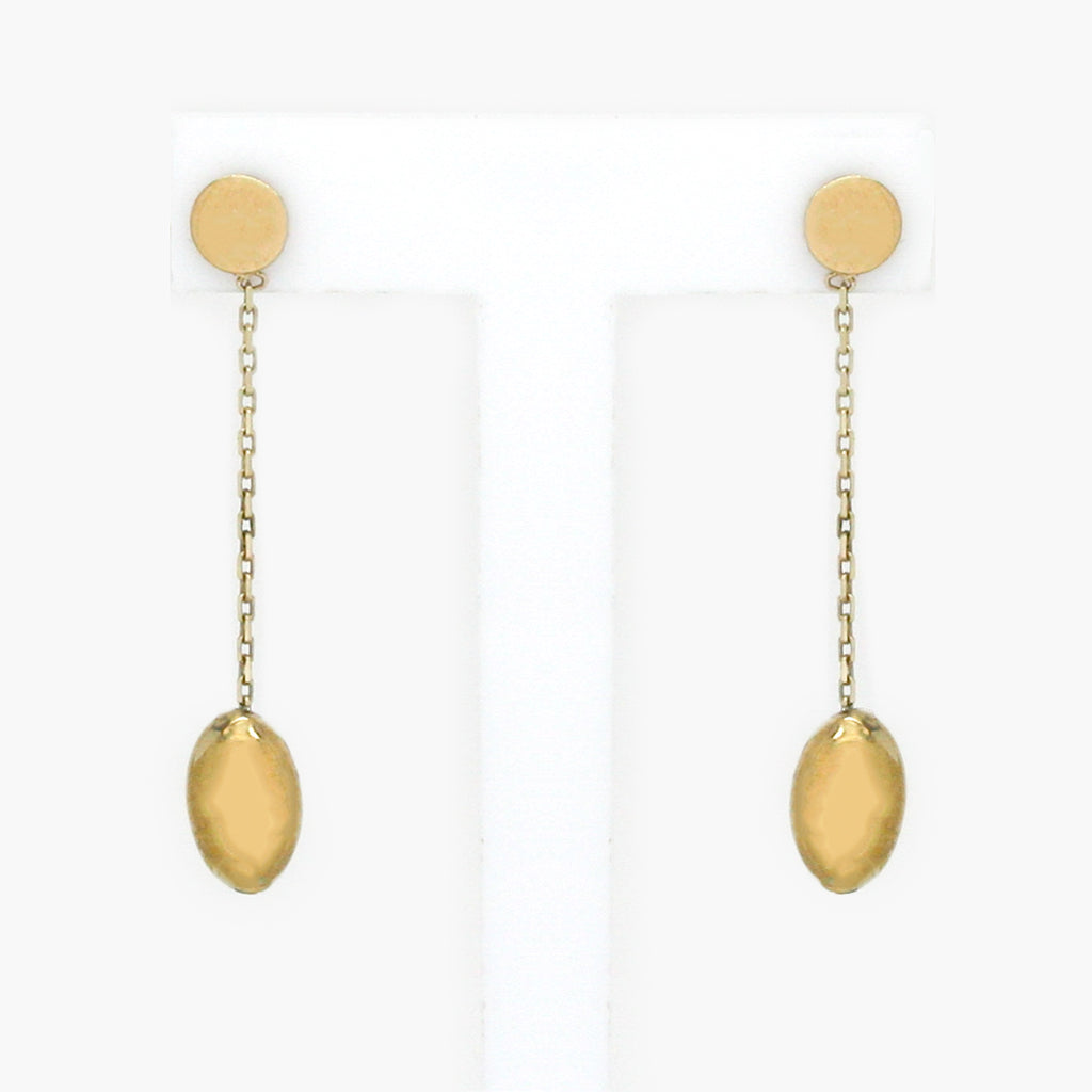 A front shot of a pair of 9 carat yellow gold drop earrings