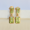 9 Carat Yellow Gold Earrings shot on a stone tray 
