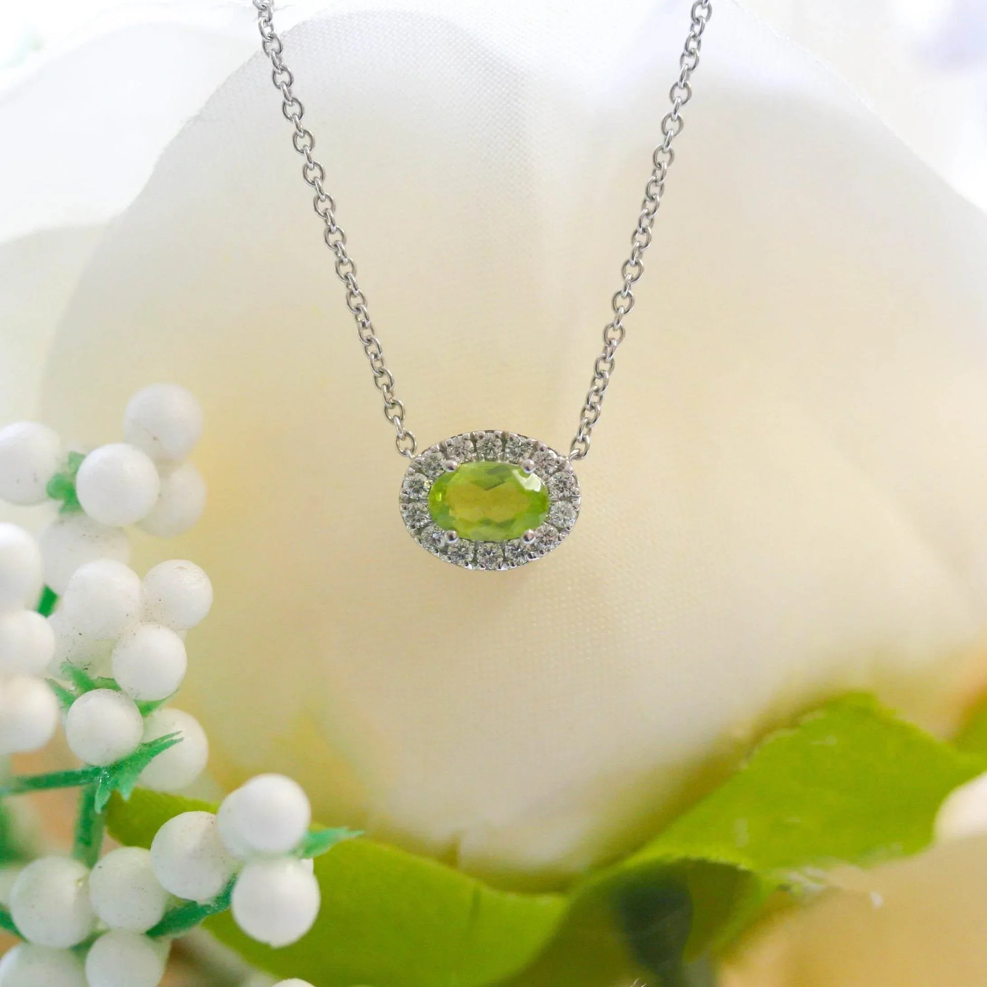 NEW 9ct White Gold Horizontal Oval Shape Peridot Pendant with Diamond Cluster Necklace - Jordans Jewellers