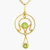 Antique peridot and seed pearl lavalier hung on a 9 carat yellow gold antique chain