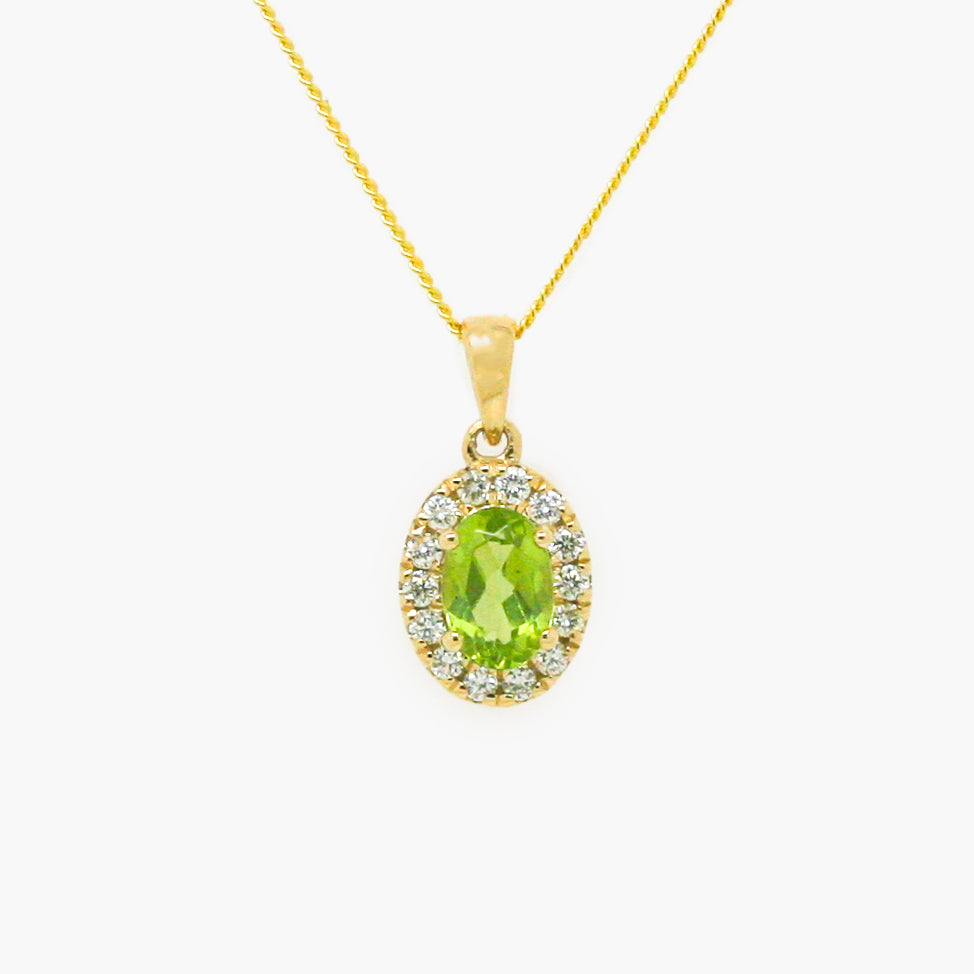 Peridot and diamond cluster pendant on a 9 carat yellow gold chain 