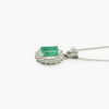 Side photo of platinum emerald and diamond pendant necklace