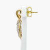 Side view of New 9 Carat Yellow Gold Diamond Tree of life drop earrings on a white stand 