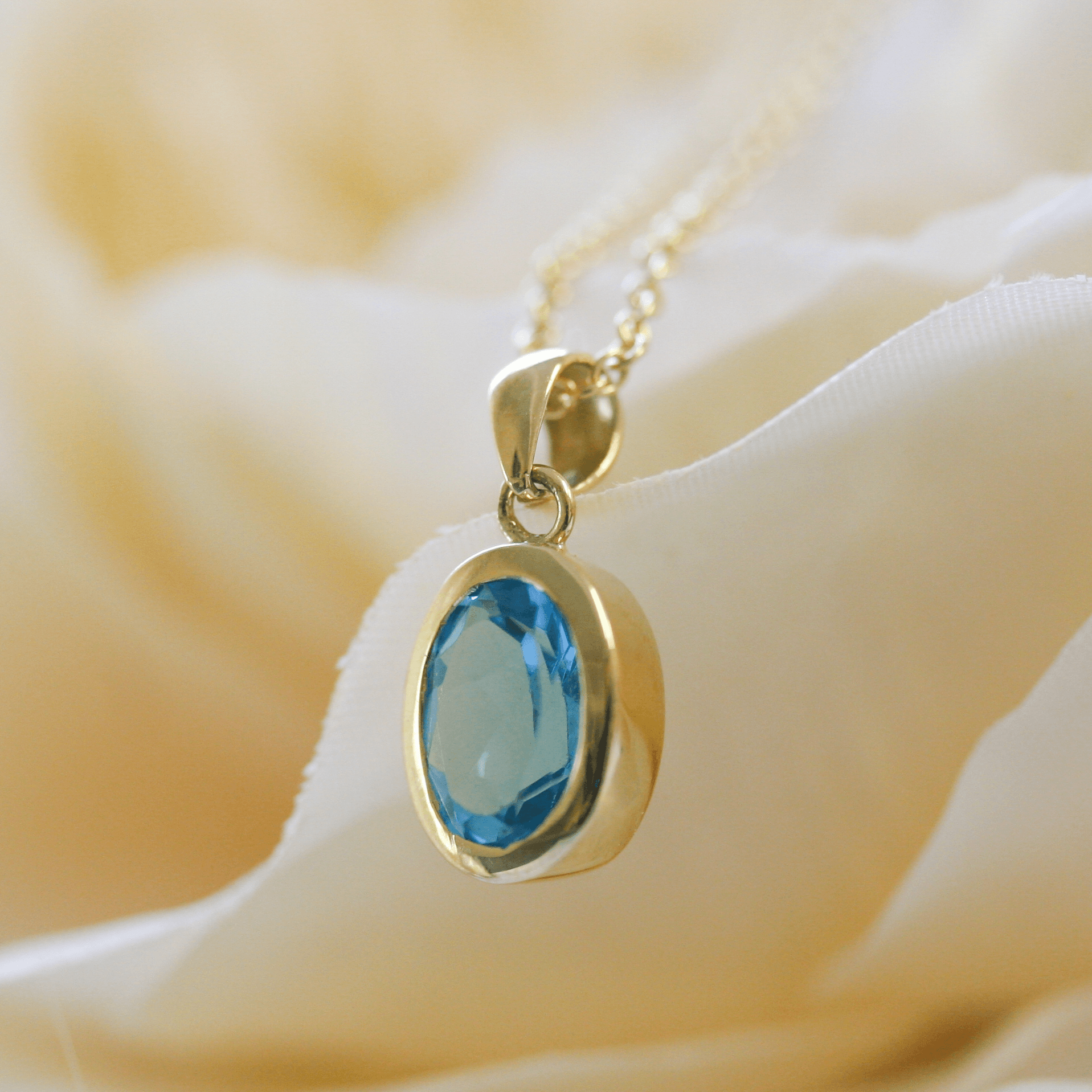 NEW 9 Carat Yellow Gold Blue Topaz Pendant Necklace - Jordans Jewellers