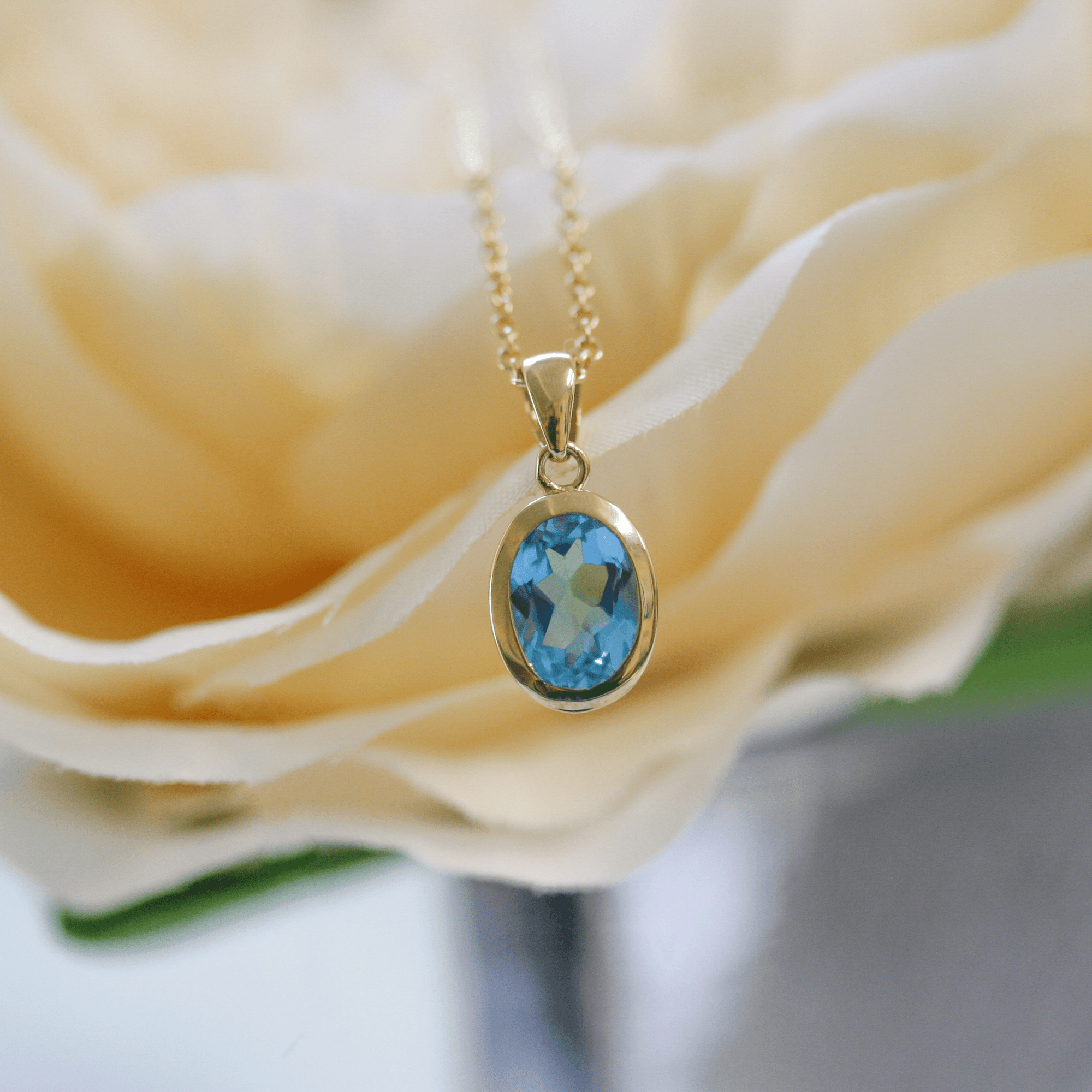NEW 9 Carat Yellow Gold Blue Topaz Pendant Necklace - Jordans Jewellers