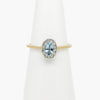 aquamarine and diamond ring on stand