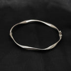 9ct White Gold Twist Hinged Bangle - Jordans Jewellers