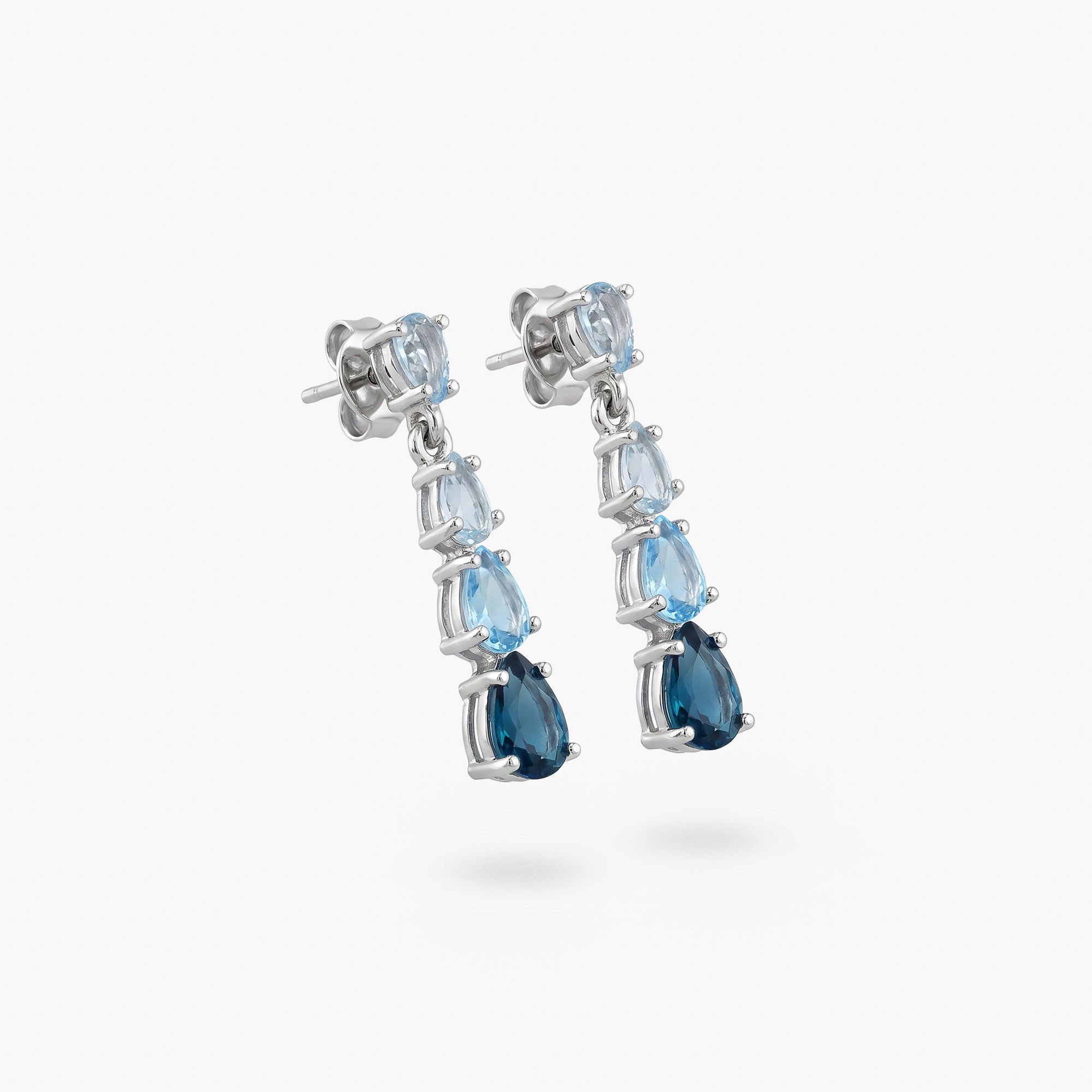 9ct White Gold Graduated Blue Topaz Pear Drop Earrings