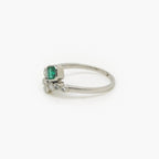 Emerald and Diamond Crossover Ring set in Platinum - Jordans Jewellers
