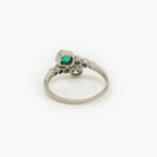 Emerald and Diamond Crossover Ring set in Platinum - Jordans Jewellers
