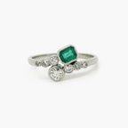 Emerald and Diamond Crossover Ring set in Platinum - Jordans Jewellers