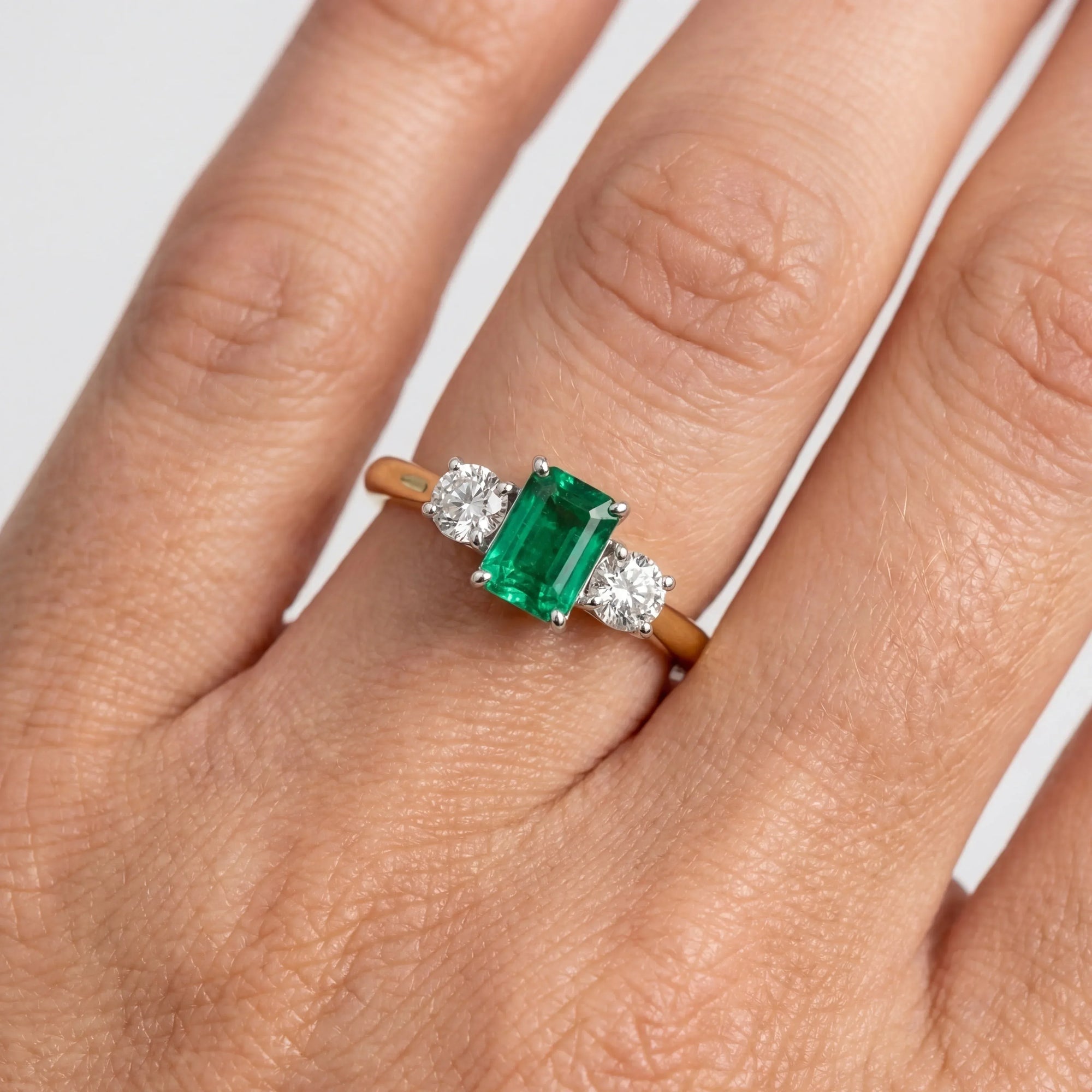 18ct Gold Emerald and Diamond Three Stone Ring - Jordans Jewellers