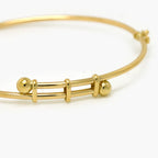 9ct Yellow Gold Double Ball Polished Bangle - Jordans Jewellers