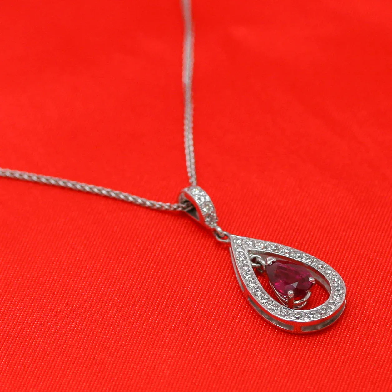 18ct White Gold Ruby & Diamond Pear Pendant - Jordans Jewellers