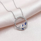 9ct White Gold Sapphire and Diamond Circle Pendant Necklace - Jordans Jewellers