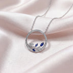 9ct White Gold Sapphire and Diamond Circle Pendant Necklace - Jordans Jewellers