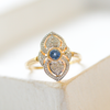 close up shot of a 9 Carat Gold Art Deco Style Sapphire & Diamond Ring