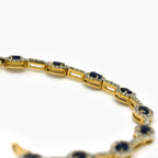9ct Gold Sapphire and Diamond Halo Bracelet - Jordans Jewellers