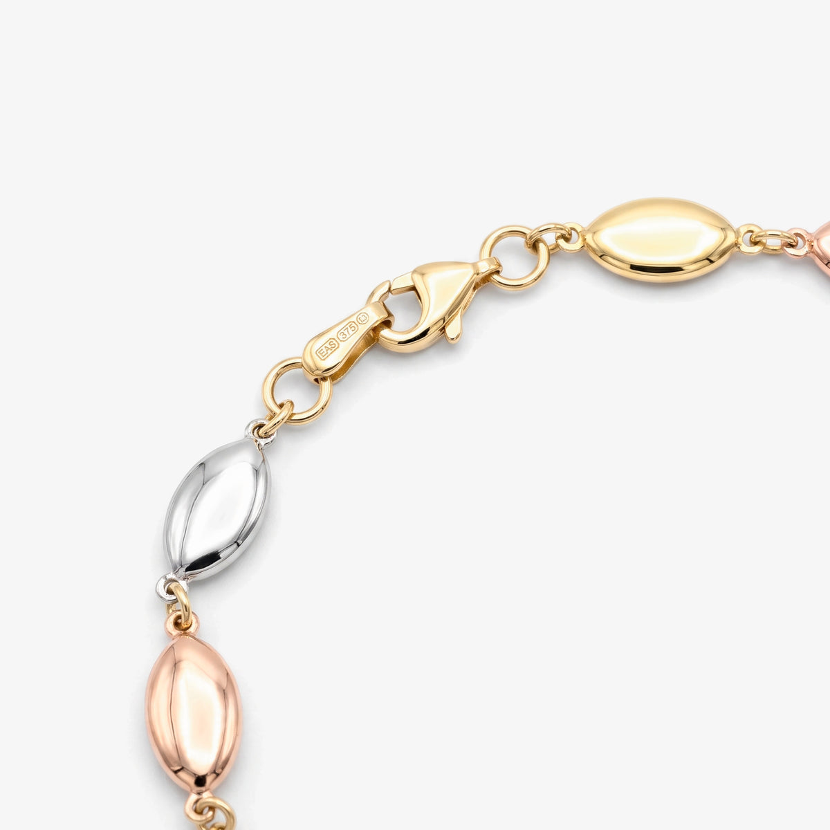 9ct Three Colour Gold Link Bracelet on wrist
