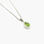 Pear Shaped Peridot Pendant Necklace in 9ct White Gold - Jordans Jewellers