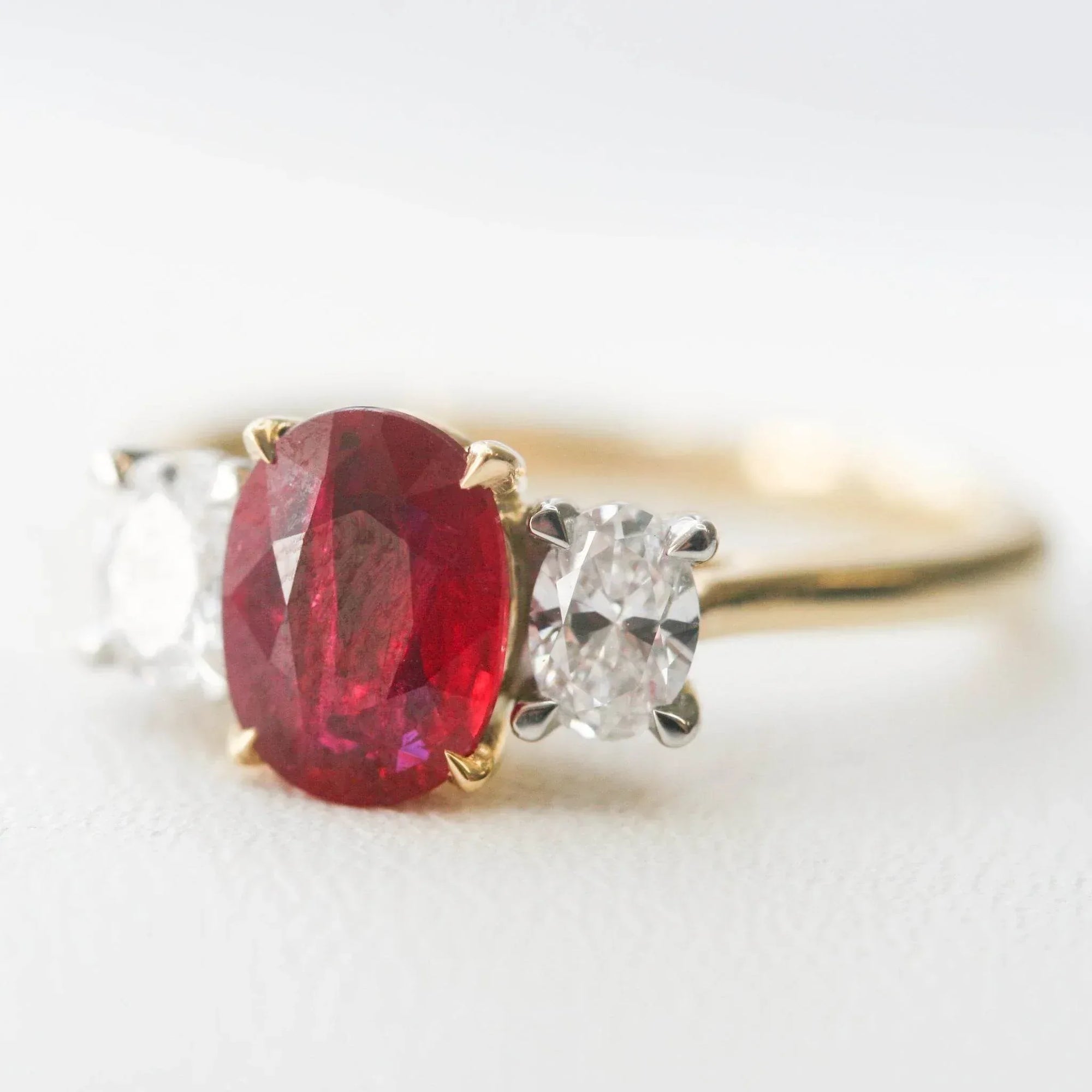 Oval Ruby & Diamond Three Stone Ring 18ct White & Yellow Gold - Jordans Jewellers