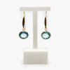 Jordans Jewellers rolled gold oval blue topaz drop earrings